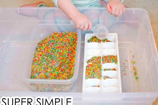 Check out this super simple rice scoop and transfer activity from Busy Toddler! This quick and easy toddler activity is perfect for life skills practice; easy toddler activity; lifeskills activity