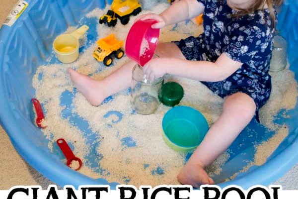 GIANT RICE POOL: What an awesome indoor toddler activity! A fun sensory idea for toddlers. A quick and easy way to entertain toddlers.