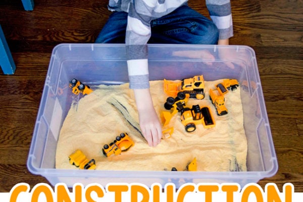 CORNMEAL CONSTRUCTION SITE - Check out this awesome sensory bin; an easy indoor activity; easy construction activity; sensory bin; toddler activity; preschool activity; construction themed sensory bin from Busy Toddler