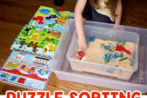 PUZZLE SORTING SENSORY BIN: A quick and easy toddler activity; an indoor activity; rainy day activity; rice sensory bin; puzzle activity; preschool activity; easy preschool activity from Busy Toddler