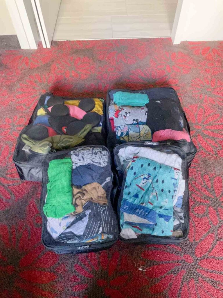 Packing cubes are used to organize a family's luggage.