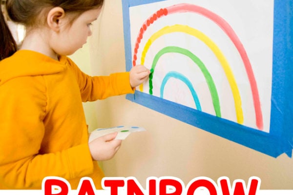 RAINBOW DOT STICKER LINE-UP: Check out this quick and easy toddler activity; an easy dot sticker activity; indoor activity; preschool activity; matching colors rainbow activity; fine motor skills activity; busy toddler activity; easy activity from Busy Toddler