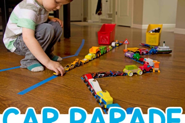 CAR PARADE: Make a quick and easy toddler activity by setting up a parade of cards; a great indoor activity for a rainy day; transportation themed activity; fun toddler play from Busy Toddler