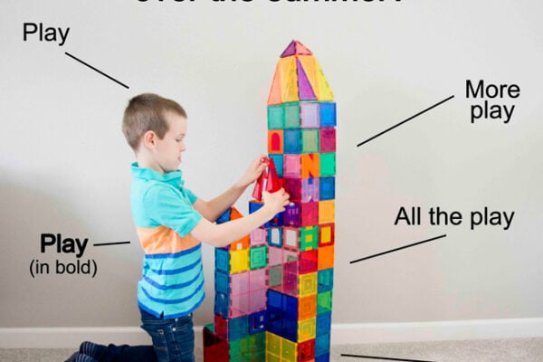 How do kids keep learning over the summer? Child playing at magnetic tiles learning by doing.