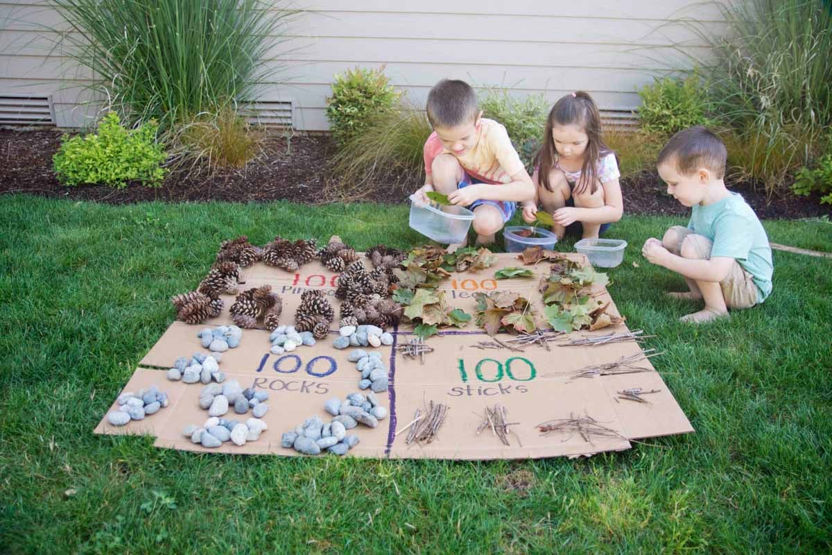 Kids learning about 100 with an outdoor math activity