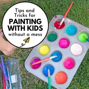 Text reads "Tips and tricks for painting with kids without a mess" image shows a muffin tin of paint on grass.