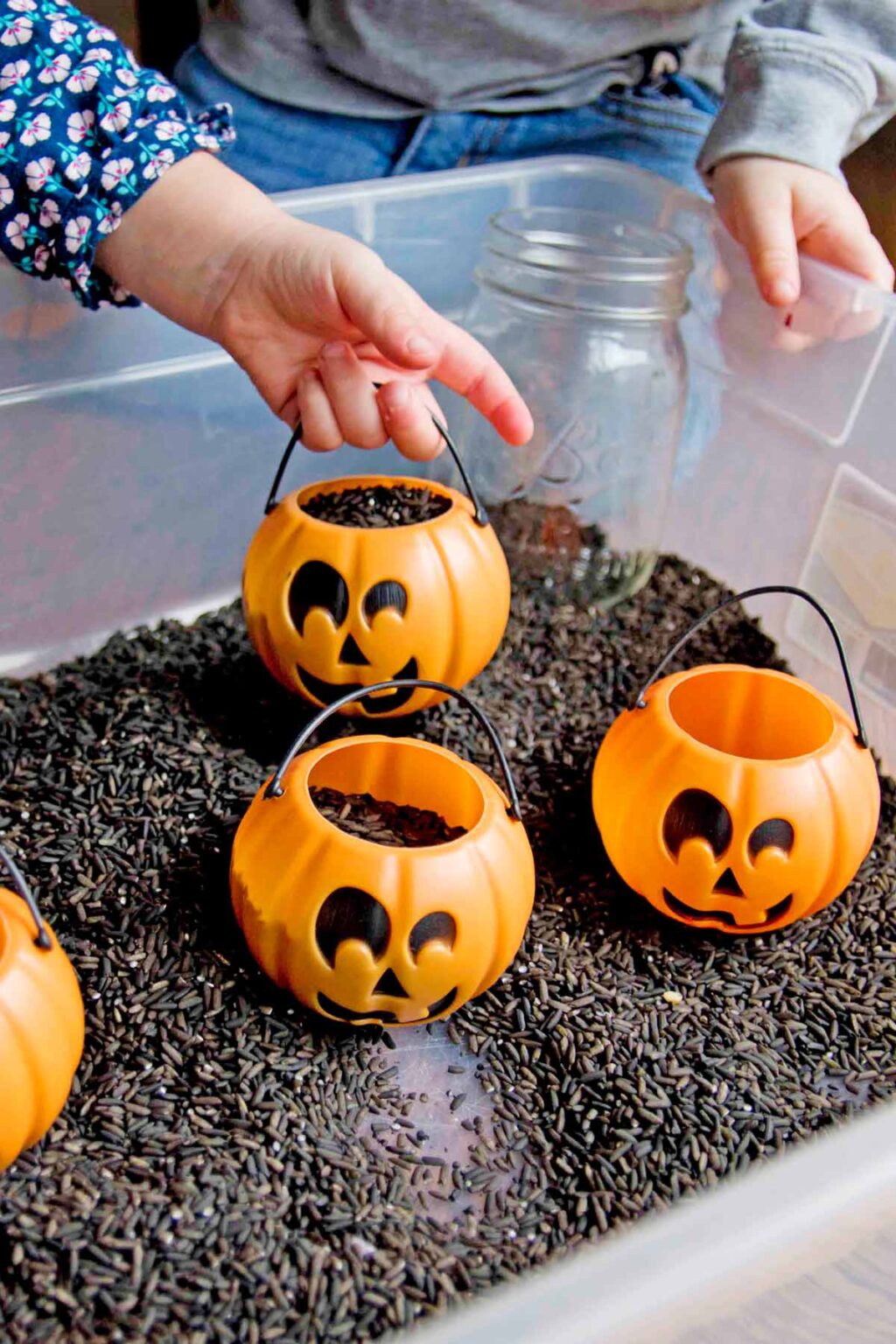 Black Rice Sensory Bin for Halloween Busy Toddler