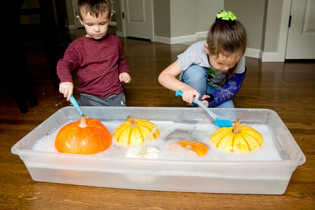 Clean the Pumpkins Fall Toddler Activity - Busy Toddler