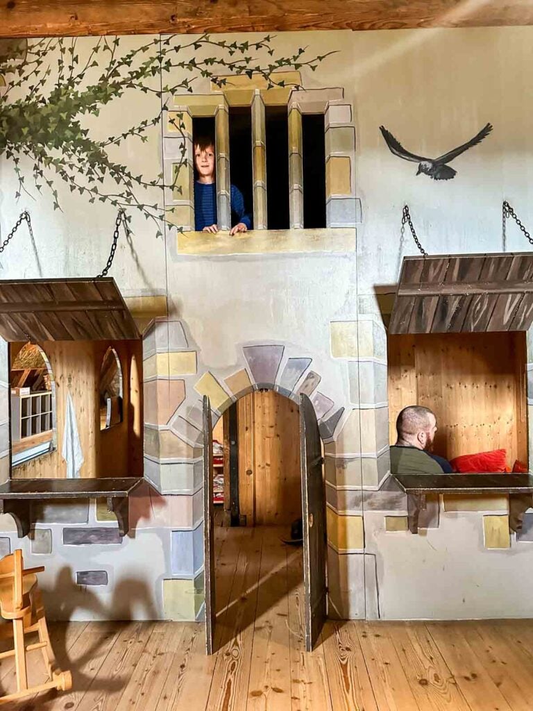 A child in a children's museum in a castle.