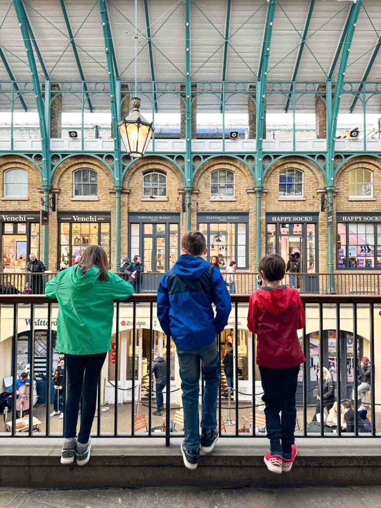 Three children overlooking Covent Garden.