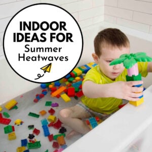 Indoor ideas for summer heatwaves - images is a child in a bath tub full of LEGO duplo bricks.