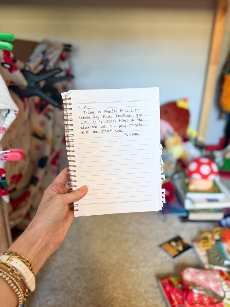 A child's schedule notebook with information about their upcoming day.